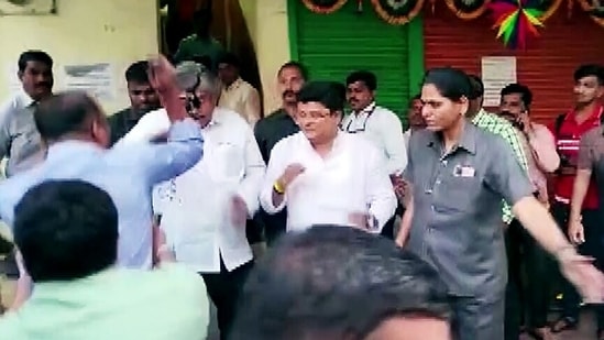 Ink was thrown at Maharashtra minister Chandrakant Patil over his alleged remark about Dr B R Ambedkar and social reformer Mahatma Jyotiba Phule, at Pimpri Chinchwad, in Pune on Saturday.(ANI)