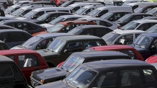 Vehicles, including Lada cars produced by the Russian automobile maker Avtovaz, are parked in Moscow. (File Photo) (REUTERS)(Representative Image)