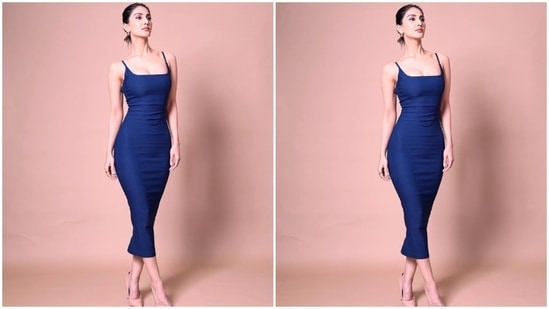 Earlier, Vaani Kapoor dropped a string of images flaunting her curves in a blue figure-grasping dress. "Syncing pictures with my mood...unfiltered,"  she captioned her post.(Instagram/@_vaanikapoor_)