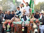 Congress leader Rahul Gandhi rides a bullock cart with supporters while leading the party's Bharat Jodo Yatra, in Bundi on Sunday.(ANI ) Congress leader Rahul Gandhi rides a bullock cart with supporters while leading the party's Bharat Jodo Yatra, in Bundi on Sunday.(ANI )