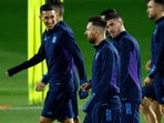 Argentina's Lionel Messi with Rodrigo De Paul and Angel Di Maria with teammates during training