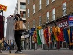UK Economy: A customer looks at a clothing stall at Petticoat Lane Market in London, UK.(Bloomberg) UK Economy: A customer looks at a clothing stall at Petticoat Lane Market in London, UK.(Bloomberg)