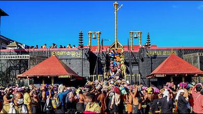 Ayyappa devotees at Sabarimala temple, in Pathanamthitta, Saturday. (PTI) Ayyappa devotees at Sabarimala temple, in Pathanamthitta, Saturday. (PTI)
