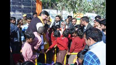 Bharatiya Janata Party MLA Rajeshwar Singh with kids after inaugurating a swing in a school on Monday. (Sourced) Bharatiya Janata Party MLA Rajeshwar Singh with kids after inaugurating a swing in a school on Monday. (Sourced)