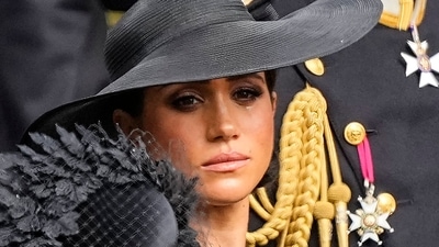 Meghan Markle: Meghan, Duchess of Sussex watches as the coffin of Queen Elizabeth II is placed into the hearse. (AP) Meghan Markle: Meghan, Duchess of Sussex watches as the coffin of Queen Elizabeth II is placed into the hearse. (AP)