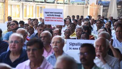 Members of Juhu wireless affected residence association protested a rule that imposes height restriction on redeveloped buildings near the signalling station at Juhu, in Mumbai. (HT Photo/Vijay Bate) Members of Juhu wireless affected residence association protested a rule that imposes height restriction on redeveloped buildings near the signalling station at Juhu, in Mumbai. (HT Photo/Vijay Bate)