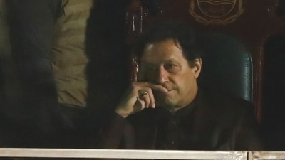 Imran Khan: Pakistan's former Prime Minister, Imran Khan, gestures from behind a bullet-proof glass window. (Reuters)