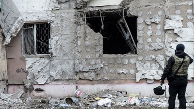 Russia-Ukraine War: A Ukrainian war crime prosecutor inspects a residential building damaged by a Russian military strike, amid Russia's attack on Ukraine continues, in Kherson. (Reuters)