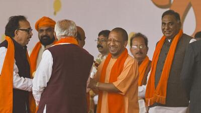 Uttar Pradesh chief minister Yogi Adityanath at the swearing-in ceremony of the Bhupendra Patel government at Gandhinagar in Gujarat on Monday. (PTI PHOTO)