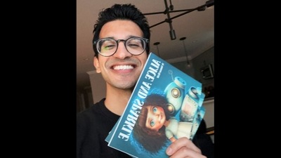 Ammaar Reshi with the book he had co-written and illustrated with AI. (Twitter/@ammaar)