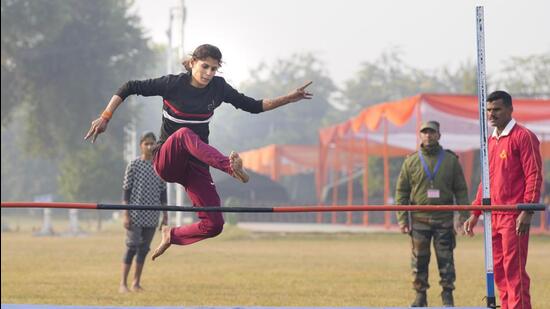A woman aspirant participates in the high jump as part of physical test for the Indian Army's recruitment scheme Agnipath, in Lucknow. (PTI)