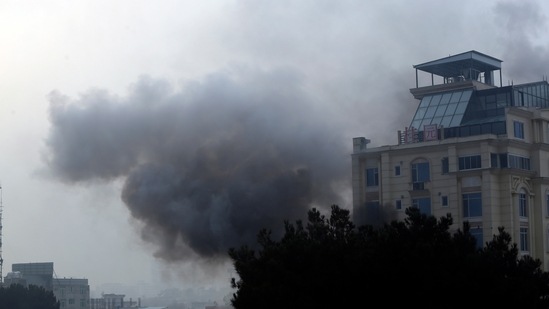 Smoke rises from a hotel building after an explosions and gunfire in Kabul, Afghanistan.(AP)