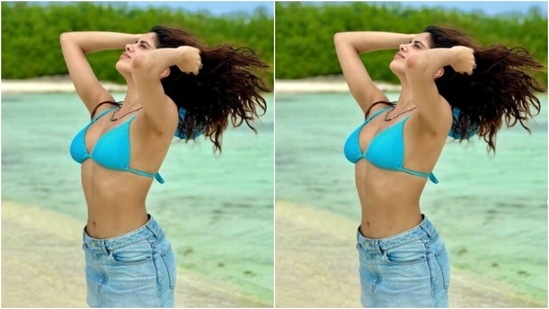 Janhvi's beach diaries are giving us major travel fashion goals. A day back, the actor soaked in the sun in a blue bra with a knot detail at the back and a denim short skirt.&nbsp;(Instagram/@janhvikapoor)