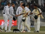 England's captain Ben Stokes (2L) shakes hands with Pakistan's Naseem Shah (C) after their victory at the end of the fifth and final day of the first cricket Test match between Pakistan and England at the Rawalpindi Cricket Stadium, in Rawalpindi on December 5, 2022. (Photo by Aamir QURESHI / AFP) England's captain Ben Stokes (2L) shakes hands with Pakistan's Naseem Shah (C) after their victory at the end of the fifth and final day of the first cricket Test match between Pakistan and England at the Rawalpindi Cricket Stadium, in Rawalpindi on December 5, 2022. (Photo by Aamir QURESHI / AFP)