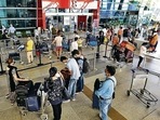Passengers queue up to enter the Delhi airport Passengers queue up to enter the Delhi airport