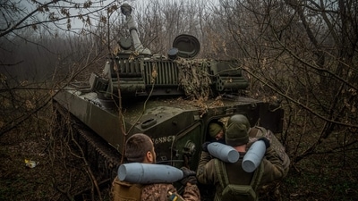 Ukrainian artillerymen from the 24th brigade load ammunition inside a 2S1 Gvozdika self-propelled howitzer at a position along the front line in the vicinity of Bakhmut, Donetsk region, on December 10. Ukraine's top military command said in its daily battlefield update on December 13 that its forces repelled Russian in 10 areas of the Donetsk region. (Ihor Tkachov / AFP) Ukrainian artillerymen from the 24th brigade load ammunition inside a 2S1 Gvozdika self-propelled howitzer at a position along the front line in the vicinity of Bakhmut, Donetsk region, on December 10. Ukraine's top military command said in its daily battlefield update on December 13 that its forces repelled Russian in 10 areas of the Donetsk region. (Ihor Tkachov / AFP)
