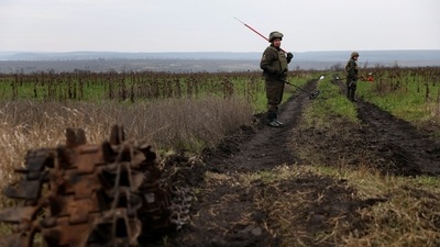 Olexandr, 41, and Petro, 50, members of the Ukrainian National guard demining team Battalion Dnipro 1, walk in mine fields, in the northern part of the Donetsk region, on December 12. Russia has claimed to be gradually advancing its positions, with the defence ministry saying on December 12 that its offensive there had killed 30 Ukrainian military personnel the day before, Reuters reported. (Shannon Stapleton / REUTERS) Olexandr, 41, and Petro, 50, members of the Ukrainian National guard demining team Battalion Dnipro 1, walk in mine fields, in the northern part of the Donetsk region, on December 12. Russia has claimed to be gradually advancing its positions, with the defence ministry saying on December 12 that its offensive there had killed 30 Ukrainian military personnel the day before, Reuters reported. (Shannon Stapleton / REUTERS)