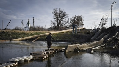 A man crosses a river on the debris of a damaged bridge in Bakhmut, Donetsk region, on December 11. "A little more than 50% of the territory of the Donetsk People's Republic has been liberated," Denis Pushilin, Russian-installed administrator of the portion controlled by Moscow, told Russian state-owned news agency RIA. (Andriy Andriyenko / AP) A man crosses a river on the debris of a damaged bridge in Bakhmut, Donetsk region, on December 11. "A little more than 50% of the territory of the Donetsk People's Republic has been liberated," Denis Pushilin, Russian-installed administrator of the portion controlled by Moscow, told Russian state-owned news agency RIA. (Andriy Andriyenko / AP)