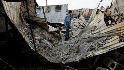 An emergencies ministry member walks at a local market hit by shelling in the course of Russia-Ukraine conflict in Donetsk, on December 12. Russian units surrounded the town of Maryinka, with fierce fighting taking place in its streets, the Russian TASS state-owned agency said on December 13, citing another Mocow-installed official, as reported by Reuters. (Alexander Ermochenko / REUTERS) An emergencies ministry member walks at a local market hit by shelling in the course of Russia-Ukraine conflict in Donetsk, on December 12. Russian units surrounded the town of Maryinka, with fierce fighting taking place in its streets, the Russian TASS state-owned agency said on December 13, citing another Mocow-installed official, as reported by Reuters. (Alexander Ermochenko / REUTERS)