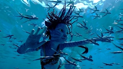 Trinity Bliss, as Tuk, in a scene from Avatar: The Way of Water. (20th Century Studios via AP) (AP) Trinity Bliss, as Tuk, in a scene from Avatar: The Way of Water. (20th Century Studios via AP) (AP)