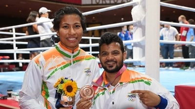 Coach Mohammad Ali Qamar with Tokyo Olympics bronze medallist Lovlina Borgohain Coach Mohammad Ali Qamar with Tokyo Olympics bronze medallist Lovlina Borgohain