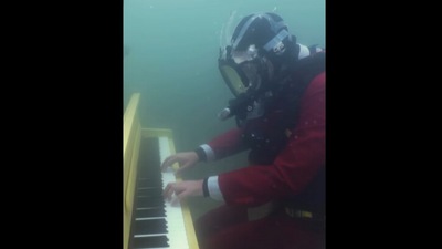 Man plays piano underwater. (Instagram/@JoeJenkins) Man plays piano underwater. (Instagram/@JoeJenkins)