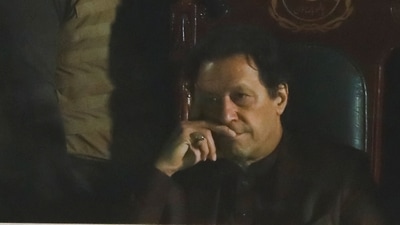 Imran Khan: Pakistan's former Prime Minister, Imran Khan, gestures from behind a bullet-proof glass window. (Reuters)