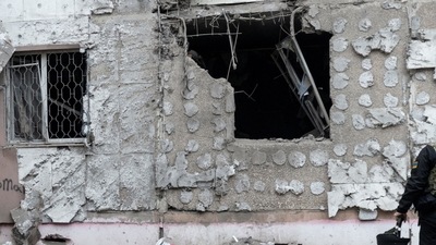 Russia-Ukraine War: A Ukrainian war crime prosecutor inspects a residential building damaged by a Russian military strike, amid Russia's attack on Ukraine continues, in Kherson. (Reuters)