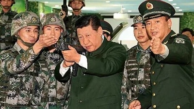 Chinese President Xi Jinping with a QBZ assault rifle. Chinese President Xi Jinping with a QBZ assault rifle.
