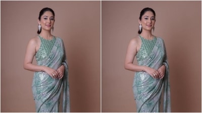 Disha further teamed her saree with a sleeveless pastel green blouse featuring a closed neckline, silver sequin details and embellishments. (Instagram/@dishaparmar) Disha further teamed her saree with a sleeveless pastel green blouse featuring a closed neckline, silver sequin details and embellishments. (Instagram/@dishaparmar)