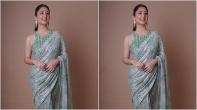 Disha looked every bit stunning in the pastel green sequined chiffon saree featuring minimal dark green details throughout. It also came with silver sequin details. (Instagram/@dishaparmar) Disha looked every bit stunning in the pastel green sequined chiffon saree featuring minimal dark green details throughout. It also came with silver sequin details. (Instagram/@dishaparmar)