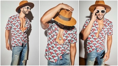 Ranveer teamed the printed shirt with acid-washed light blue denim jeans featuring a mid-rise waist, distressed details on the front, frayed hem, and a straight-leg fitting. A suede beige cowboy hat, quirky black-tinted sunglasses, and white heeled boots completed the outfit. (Instagram) Ranveer teamed the printed shirt with acid-washed light blue denim jeans featuring a mid-rise waist, distressed details on the front, frayed hem, and a straight-leg fitting. A suede beige cowboy hat, quirky black-tinted sunglasses, and white heeled boots completed the outfit. (Instagram)