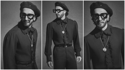 Ranveer styled the ensemble with a matching black leather belt, black and white dress shoes, a sleek chain, quirky glasses, a trimmed beard, a beret cap, and ear studs. What do you think of his promotion outfits? (Instagram) Ranveer styled the ensemble with a matching black leather belt, black and white dress shoes, a sleek chain, quirky glasses, a trimmed beard, a beret cap, and ear studs. What do you think of his promotion outfits? (Instagram)