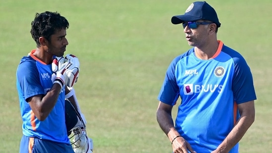 India's cricket coach Rahul Dravid (R) speaks with Abhimanyu Easwaran during a practice session at the Zahur Ahmed Chowdhury Stadium in Chittagong on December 11, 2022, ahead of their first cricket Test match against Bangladesh. (Photo by Munir uz zaman / AFP)(AFP)