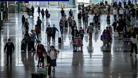 Some curbs such as PCR tests for visitors arriving in Hong Kong, rapid antigen tests for school students, and wearing masks outdoors still remain. (AFP)