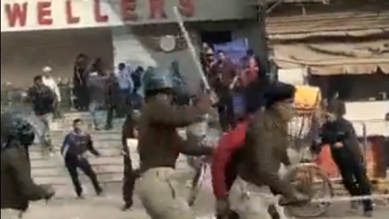Hundreds of police personnel can be seen chasing the protestors and beating them with sticks and batons (Twitter Photo)
