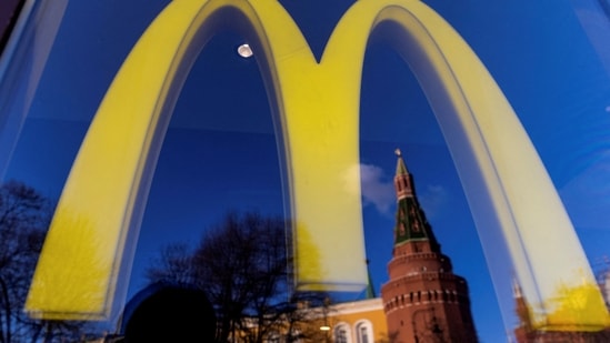 Russia-Ukraine War: A logo of the McDonald's restaurant is seen in the window with a reflection of Kremlin's tower in central Moscow.(Reuters)