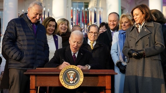 US President Joe Biden signs the 'Respect for Marriage Act,' a landmark bill protecting same-sex marriage, at the White House in Washington.(REUTERS)