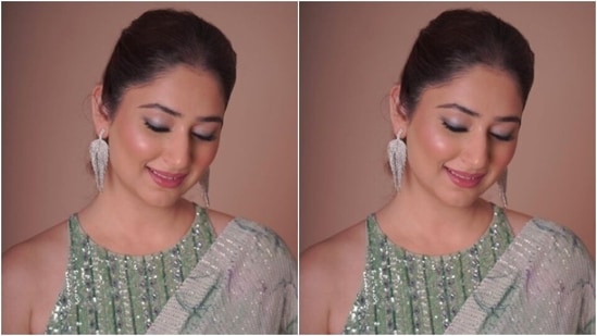 Assisted by makeup artist Dishi Sanghvi, Disha decked up in grey and silver eyeshadow, black eyeliner, mascara-laden eyelashes, drawn eyebrows, contoured cheeks and a shade of pink lipstick. (Instagram/@dishaparmar)