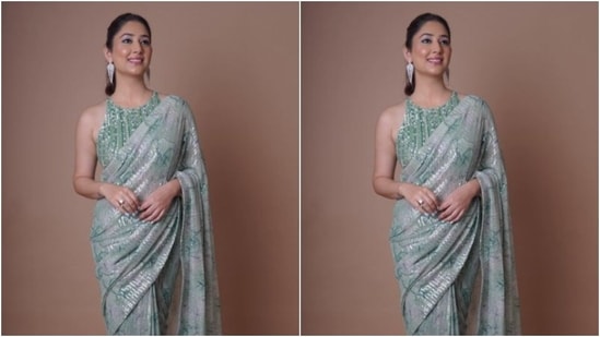 Disha looked every bit stunning in the pastel green sequined chiffon saree featuring minimal dark green details throughout. It also came with silver sequin details. (Instagram/@dishaparmar)