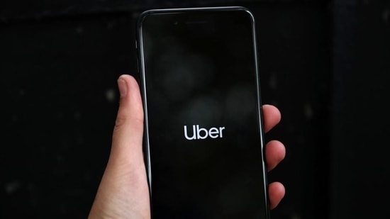 Uber's logo is displayed on a mobile phone in London, Britain on September 14.(REUTERS)