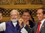 When the Indonesian president was handing over the ceremonial gavel to PM Modi, first, both of them first raised the presidential gavel in the air together. (AFP) When the Indonesian president was handing over the ceremonial gavel to PM Modi, first, both of them first raised the presidential gavel in the air together. (AFP)