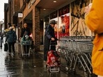 UK Inflation: Shoppers outside a Marks and Spencer Group Plc store in Reigate, UK. UK Inflation: Shoppers outside a Marks and Spencer Group Plc store in Reigate, UK.