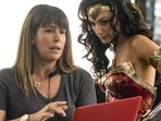 This image released by Warner Bros. Entertainment shows director Patty Jenkins, left, with actress Gal Gadot on the set of Wonder Woman 1984. This image released by Warner Bros. Entertainment shows director Patty Jenkins, left, with actress Gal Gadot on the set of Wonder Woman 1984.