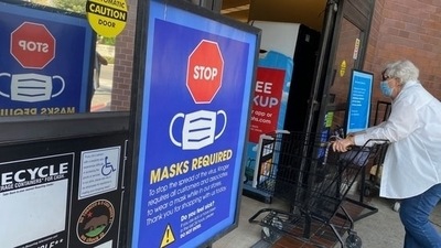 Covid In US: People shop at a grocery store enforcing the wearing of masks in Los Angeles. (AFP) Covid In US: People shop at a grocery store enforcing the wearing of masks in Los Angeles. (AFP)