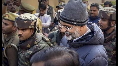 Gangster-turned-politician Mukhtar Ansari being produced in a court in connection with a money laundering case, in Prayagraj, Wednesday. (PTI Photo) Gangster-turned-politician Mukhtar Ansari being produced in a court in connection with a money laundering case, in Prayagraj, Wednesday. (PTI Photo)