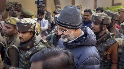 Gangster-turned-politician Mukhtar Ansari being produced in a district court in connection with a money laundering case, in Prayagraj on Wednesday. (PTI)