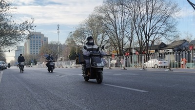 Covid In China: People ride on a road amid the coronavirus disease (COVID-19) outbreak in Beijing, China. (Reuters)