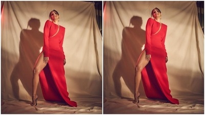 The ensemble features a round neckline, padded shoulders, full-length sleeves with ornate gold buttoned cuffs, a cut-out on the front flaunting her décolletage and midriff, a figure-skimming silhouette, floor-sweeping hem length, and a risqué high slit on the side exposing Malaika's leg. (Instagram) The ensemble features a round neckline, padded shoulders, full-length sleeves with ornate gold buttoned cuffs, a cut-out on the front flaunting her décolletage and midriff, a figure-skimming silhouette, floor-sweeping hem length, and a risqué high slit on the side exposing Malaika's leg. (Instagram)