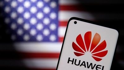 Huawei: Smartphone with a Huawei logo is seen in front of a US flag in this illustration taken in 2021. (Reuters)